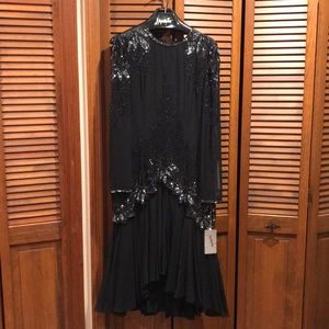 Beaded black tea length gown. New, never warn.